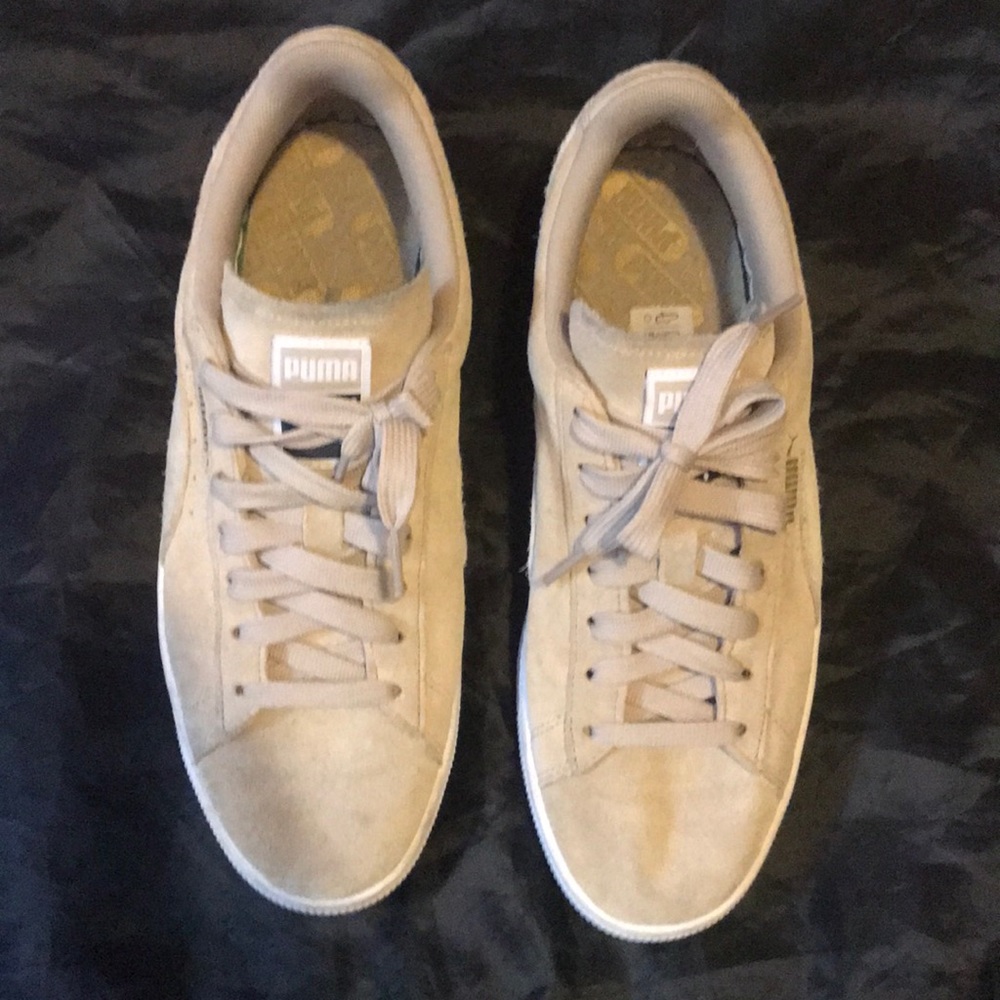 Classic tan Puma sneakers.
